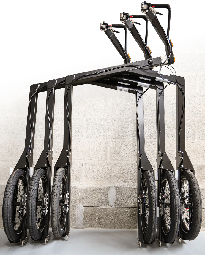 Three BicyLift trailers against a wall