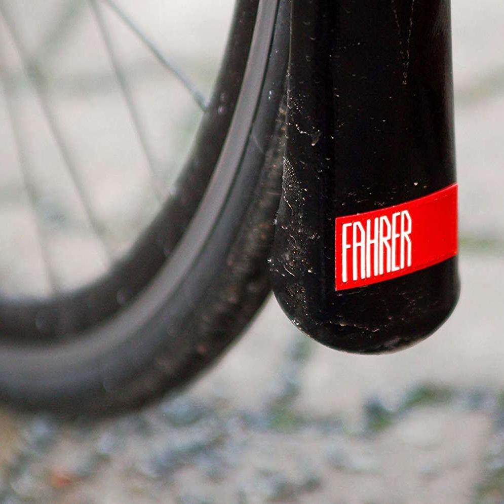 mud flap behind a bicycle wheel