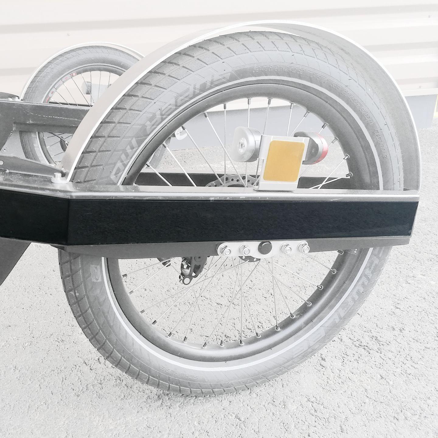 Protective bands on the BicyLift bike trailer next to its wheel