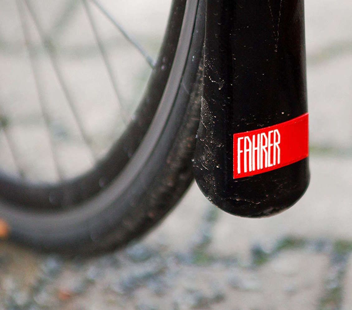Bike wheel with a black mudguard withe a red part and fahrer written in white on it